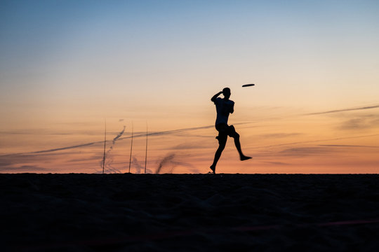 Frisbee Player At Sunset