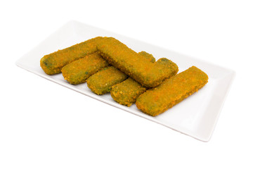 Spinach sticks on a tray on a white background