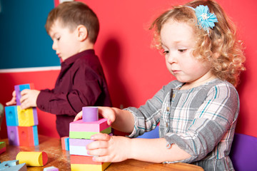 Obraz na płótnie Canvas The preschoolers group in kindergarten together, Nursery group play with block ,