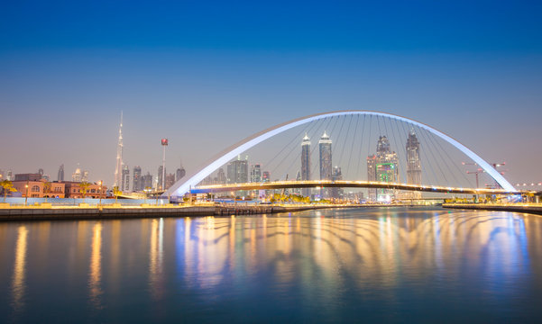 Dubai city skyline at night. view of Tolerance bridge