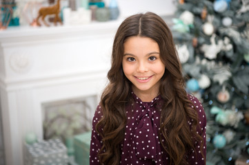 Happy new year. Kid enjoy the holiday. small happy girl at christmas. The morning before Xmas. New...