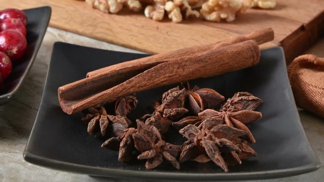 Star anise, cinnamon sticks, chopped walnuts and holiday spices