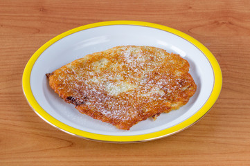Polish placki ziemniaczane with sugar. Potato pancakes, latkes, deruny or boxties