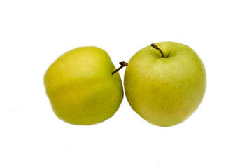Two yellow apples on a white background