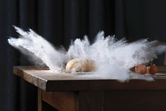 Dough falling onto floured surface