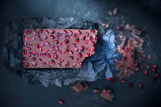 Vegan chocolate bar with pomegranate seeds