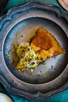 Overhead view of slice of apricot and olive oil cake served on plate