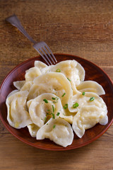 Dumplings, filled with mashed potato. Varenyky, vareniki, pierogi, pyrohy - dumplings with filling, popular dish in many countries