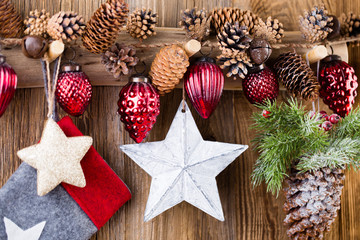 Christmas greeting card. Festive decoration on wooden background. New Year concept. Copy space.  Flat lay. Top view.