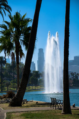 The fountain at Echo Park in Los Angeles, California with the downtown skyline in the background