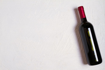 Bottle of wine on white background. Wine still life. top view, horizontal
