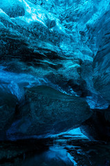 Ice Caves or Crystal Caves in Icelandic glaciers are a truly mesmerizing wonder of nature. The blue-glazed glacier blows away and creates amazing caves. Running water and black sand...