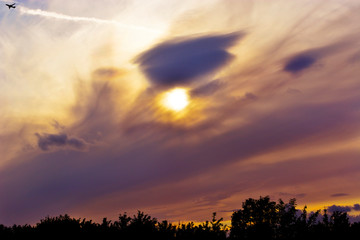 Aeroplane and Eye Pattern in the Clouds