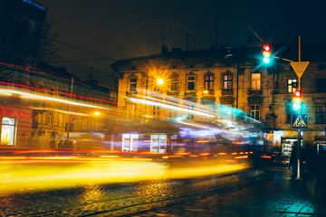 Fototapeta na wymiar Lviv night car trails on the vintage building background, ukraine