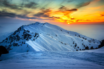 Fototapeta na wymiar sunset in the snow mountains