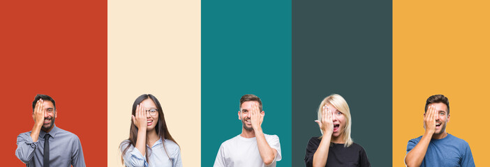 Collage of different ethnics young people over colorful stripes isolated background covering one eye with hand with confident smile on face and surprise emotion.