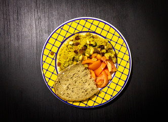 Couscous Dish on Black Wooden Background