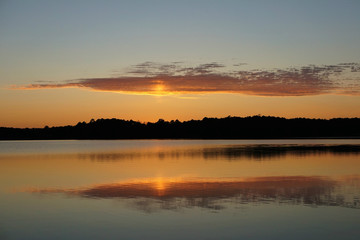 Fototapeta na wymiar Reflection of sunset in the lake