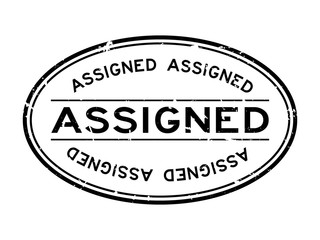 Grunge black assigned word oval rubber seal stamp on white background