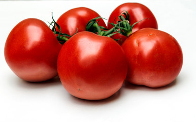 Tomatoes surrounded by white background