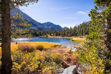 Alpine lake surrounded by the rocky ridges of the Eastern Sierra mountains; Heart Lake, Little Lakes Valley trail, John Muir wilderness, California