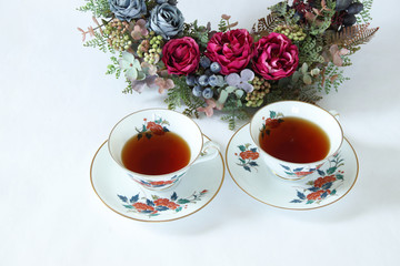 Obraz na płótnie Canvas バラのリースと紅茶