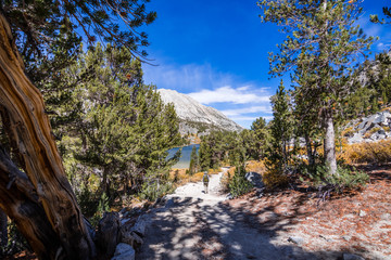 Hiking trail following the shoreline of Long Lake, Little Lakes Valley trail, John Muir wilderness, Eastern Sierra mountains, California