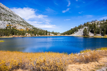 View of Heart Lake in the Eastern Sierra mountains on a sunny autumn day, Little Lakes Valley trail, John Muir wilderness, California