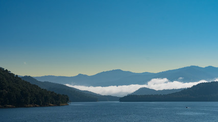 Fototapeta na wymiar Reservoir with mountain and beautiful sky.