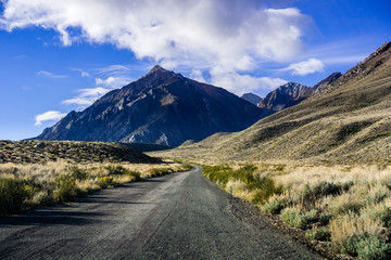 Driving on a narrow mountain road towards the Eastern Sierra mountains, California