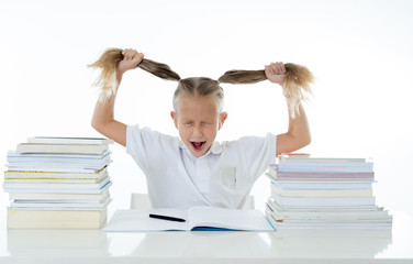 Stressed school girl feeling frustrated and unable to concentrate in her studies