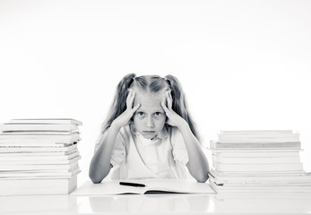 Sad unhappy cute little girl overwhelm with homework and studies