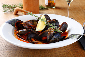 dish with mussels on a white plate