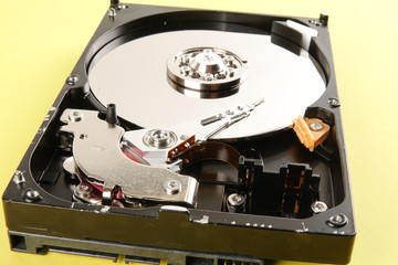 Hard disk drive (HDD) isolated on a yellow background