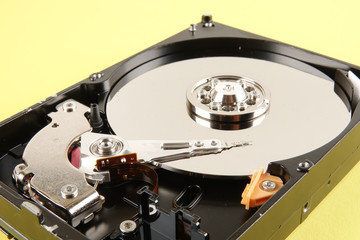 Hard disk drive (HDD) isolated on a yellow background