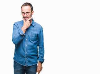 Middle age hoary senior man wearing glasses over isolated background looking confident at the camera with smile with crossed arms and hand raised on chin. Thinking positive.