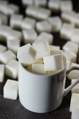 Sugar cubes with mug cup