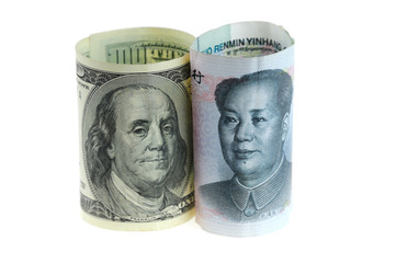 close up on US dollar and Chinese RMB bills isolated on white background