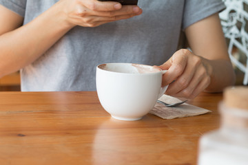 Woman enjoying warming drink, Late coffee in a cup