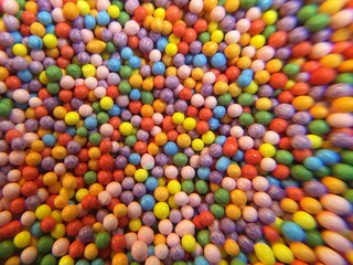 Fototapeta na wymiar Sugar sprinkle dots as a background