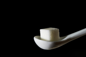 Sugar cube on spoon 