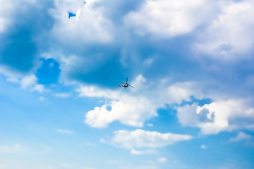 Bright blue sky with clouds and the helicopter