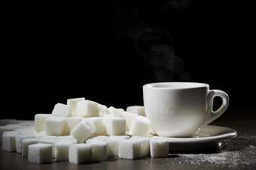 Sugar cubes with cup of coffee 