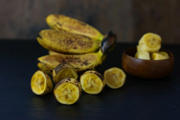 Sweet golden banana fruit isolate on table wood

