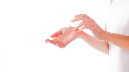 Hands with cream isolated on white. Woman apply cream.