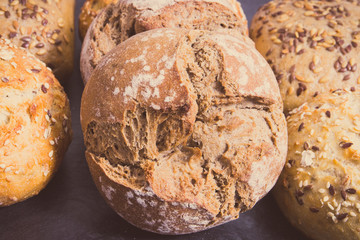Wholegrain homemade rolls with seeds. Vintage photo