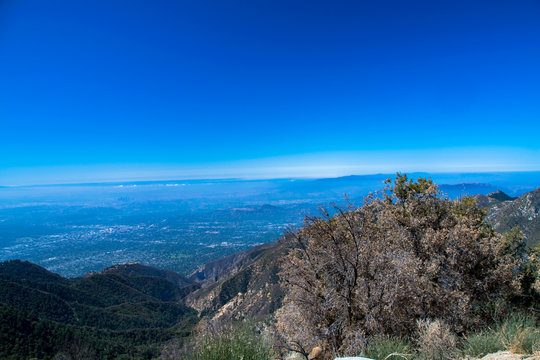 A panorama of the Los Angeles basin through the mist as seen from the San Gabriel Mountains in Cailofrnia