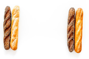 Baguettes. White and brown on white background top view