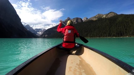 View of female Kayaking Lake Louise Alberta Canada