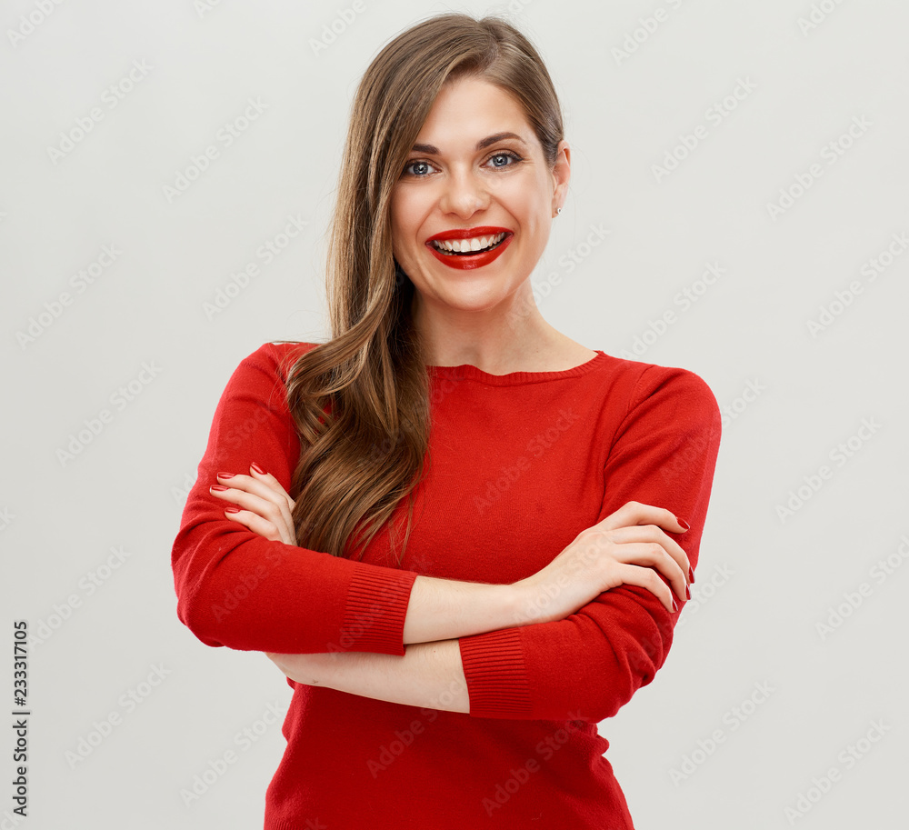 Wall mural smiling woman in red with crossed arms.